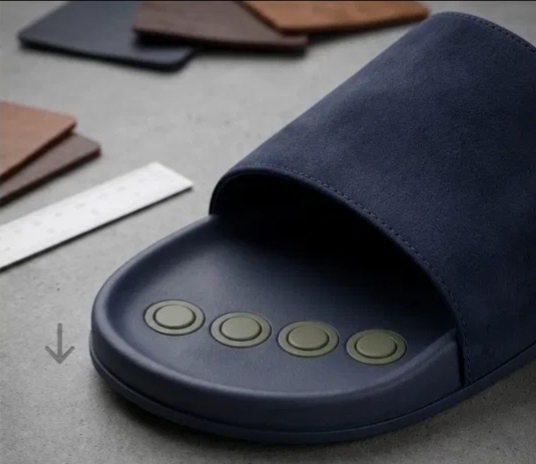 MODTOES slide with modules retracted flush with the sole, studio shot with calipers and leather swatches